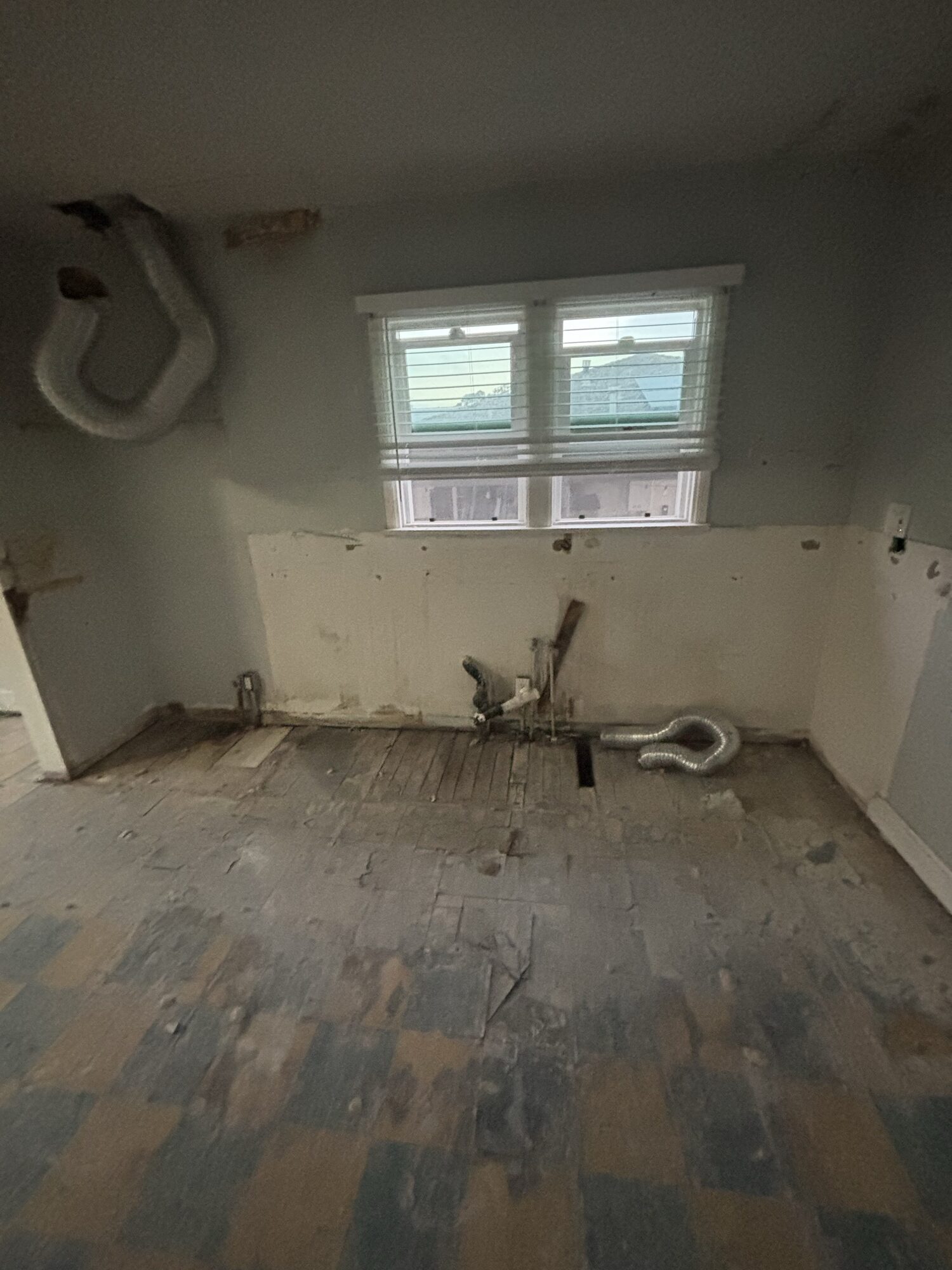 North County San Diego kitchen after OSR demolition and cleanout — cabinets, counters and flooring removed and hauled off, down to a clean shell